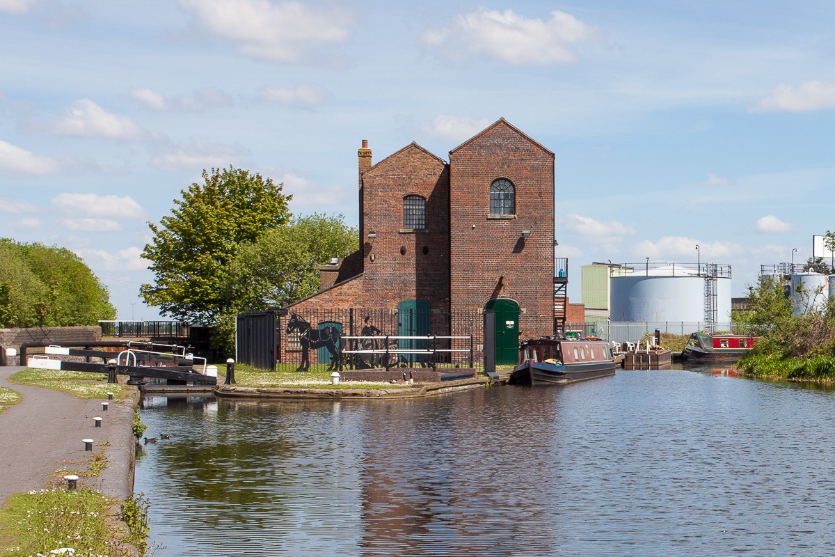 The Titford Canal - Oldbury Top Lock and the Pump House. The narrowboat on the right is moored at the Tat Bank Branch, a feeder to Rotton Park (Edgbaston) reservoir that is navigableonly for a short length.